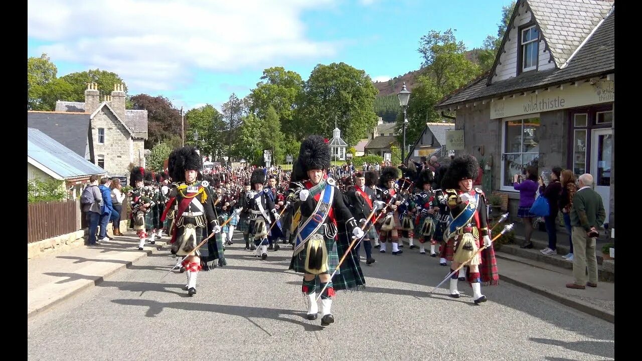 Braemar Royal Highland Gathering. Braemar games. Parade through Town. The Massed Pipes and Drums Edinburgh. Through the town