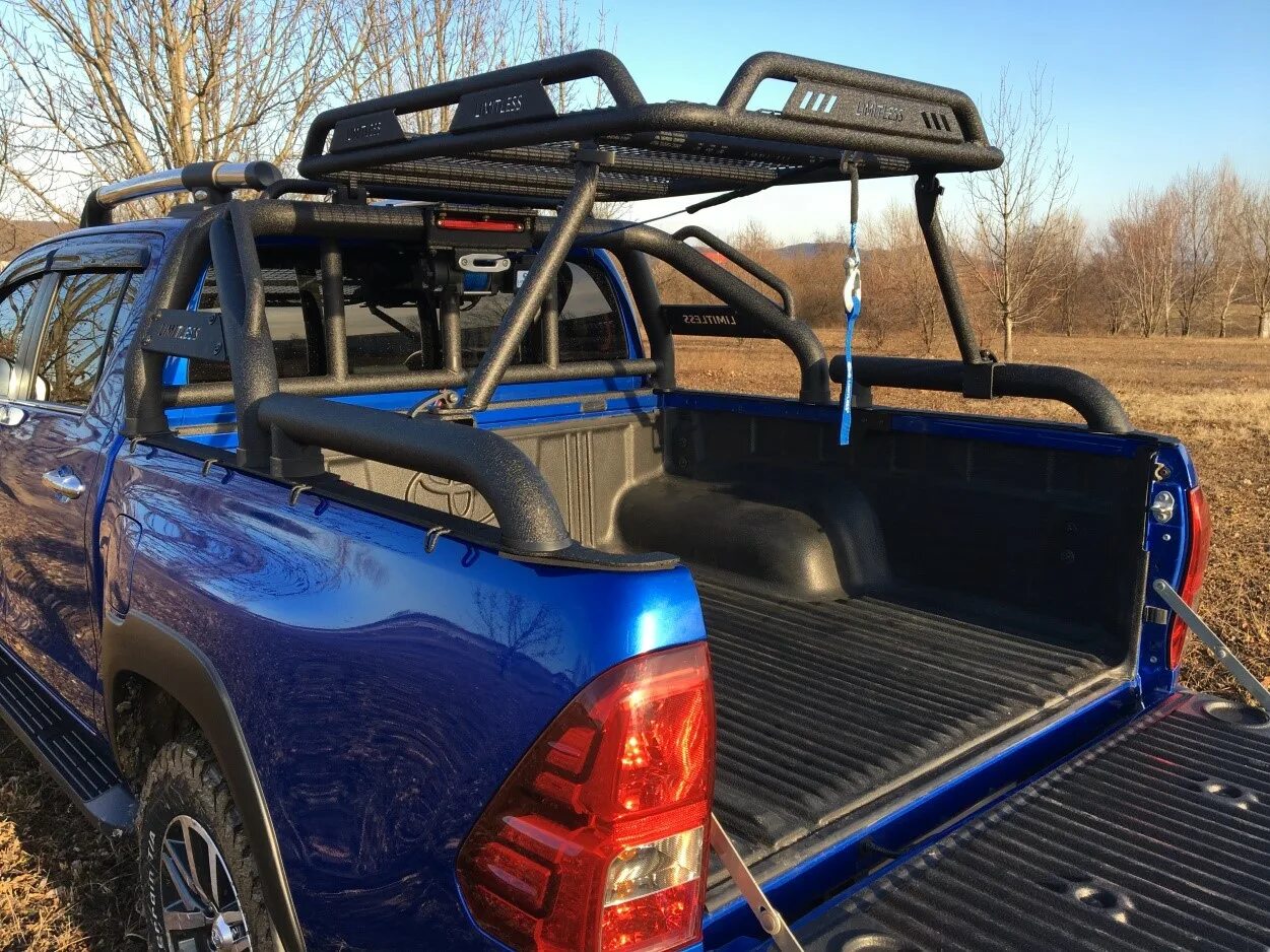Багажник на пикап. Тойота хайлюкс с багажником. тойота hilux пикап багажник. дуга в кузов хайлюкс м2. дуга в кузов toyota hilux gr adventure 2025.