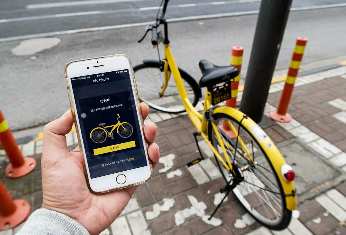 Ofo велосипеды. Шеринг велосипедов. Велопрокат смартфон. Велосипедный Шеринг в Китае.