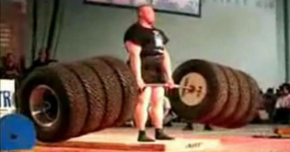 Вес поднимаемый человеком. Становая тяга 500 кг. Штанга 300 кг. Огромная штанга. Самый сильный человек в мире.