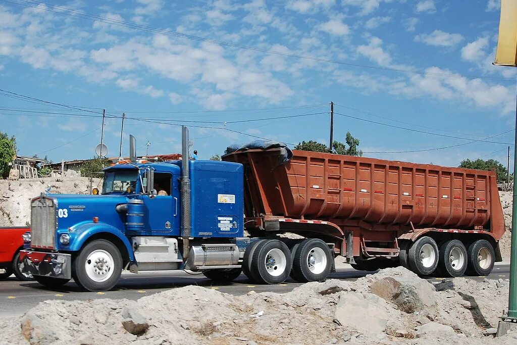 Купить самосвал на трак ав бу. Mack 124 самосвал. Kenworth big Rig. Самосвал Trailor 1995г. Самосвал американец полуприцеп.