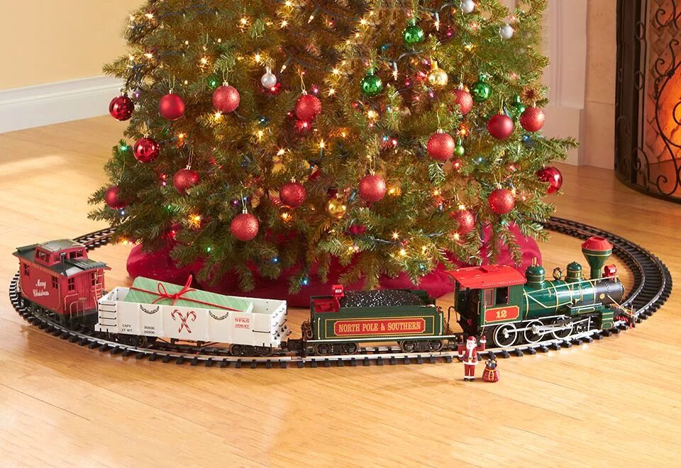 Новогодняя железная дорога. Железная дорога &quot;christmas train&quot;. елка с железной дорогой. новогодняя железная дорога на елку. новогодняя железная дорога вокруг елки.