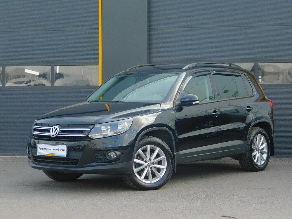 Фольксваген тигуан 2015. Volkswagen Tiguan 2015 черный. Фольксваген Тигуан 2015 черный. Фольксваген Тигуан 2015г. Фольксваген Тигуан 2 Рестайлинг.