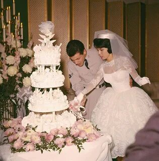 Nancy Sinatra and Tommy Sands are shown together as they cut their wedding ...