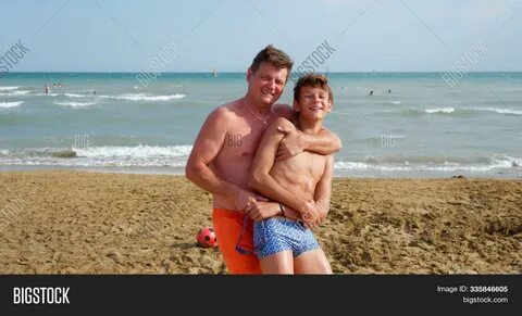 Download high-quality Father son beach Bibione, Italy images
