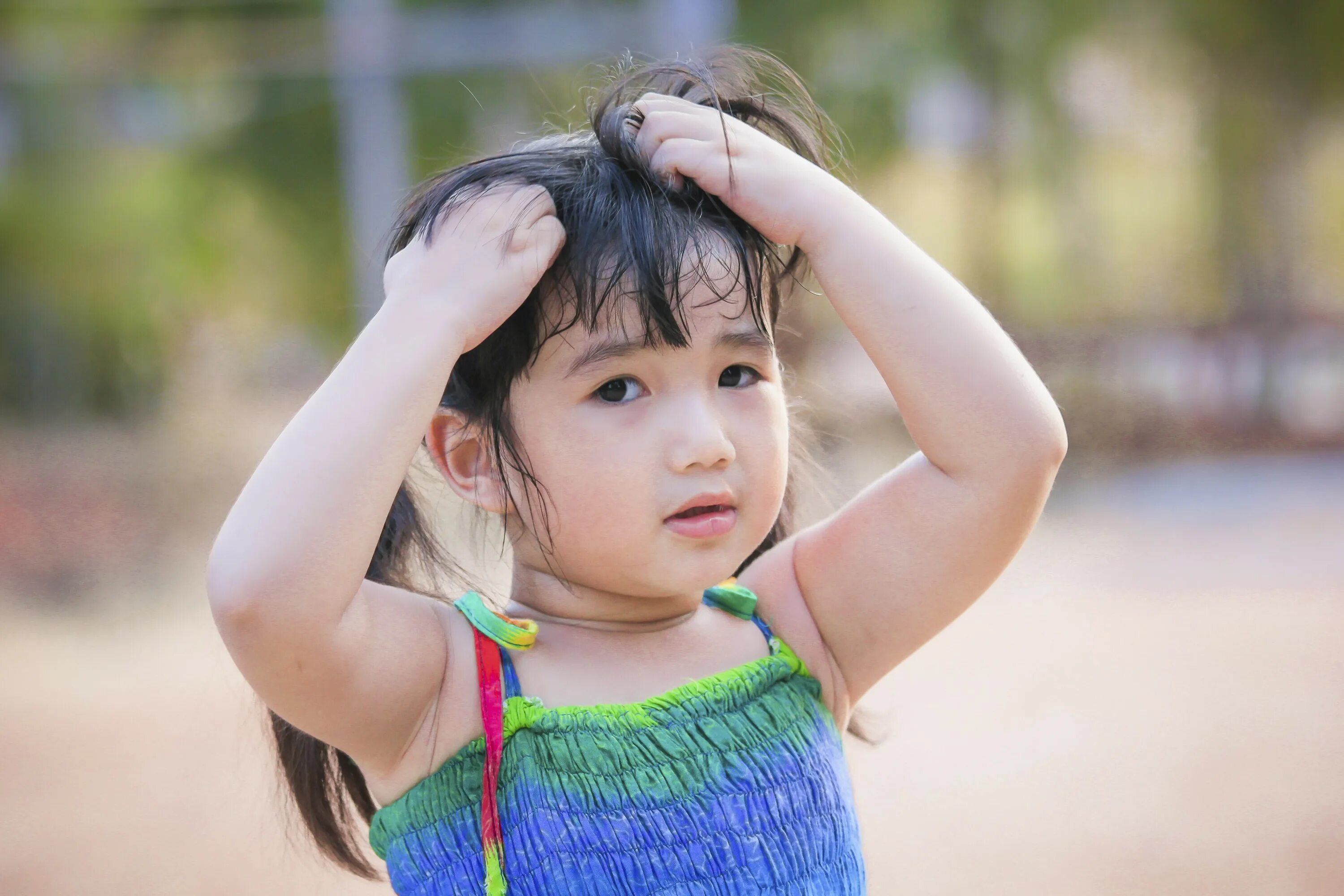 Child head. Child scratching head.
