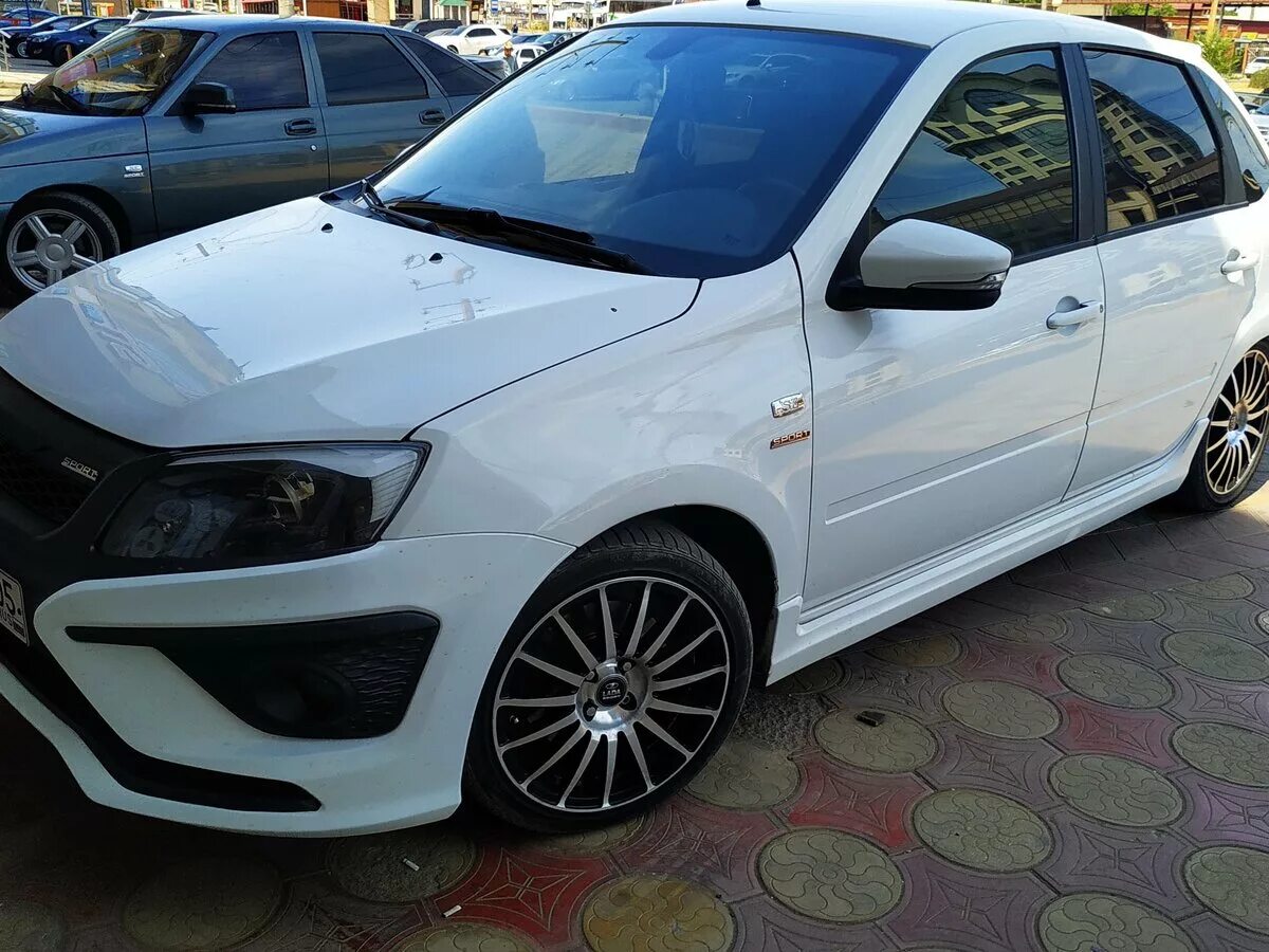 Лада гранта спорт 2014. Гранта спорт всмпо r15. Granta sport 2014. Гранта белого цвета 2014 года вид. Стекло на гранта седан 2014.