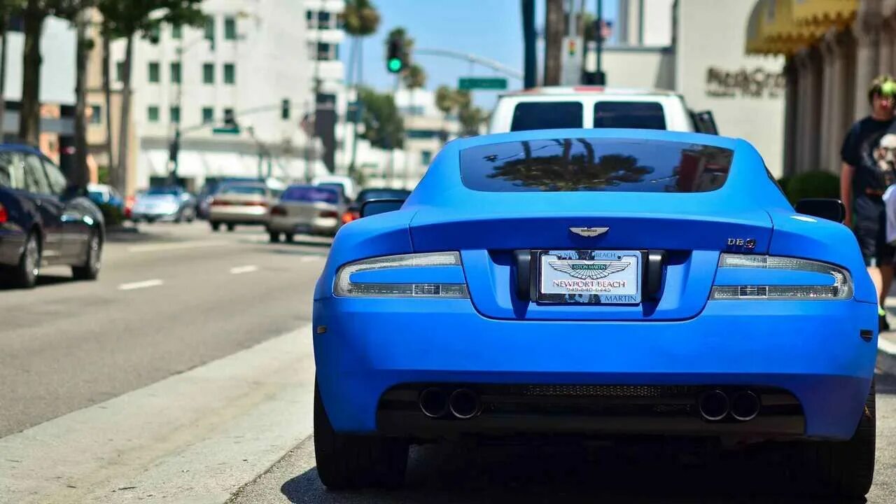 Blue sport. Aston Martin db9 голубой. Астон Мартин машина матовый синий. Астон Мартин синий сзади. Спортивные машины синего цвета.