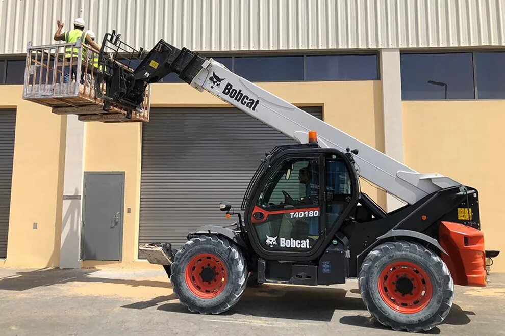 Bobcat телескопический. Bobcat 40180. Телескопический погрузчик Bobcat. Телескопический погрузчик Дусан 160. Вилочный погрузчик телескопический Bobcat.