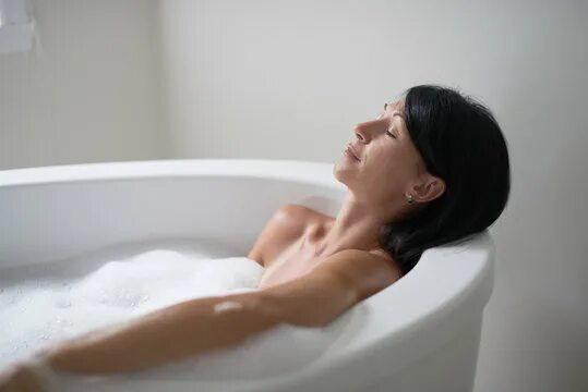 Woman in bath relaxing stock image. Image of skincare 48581007