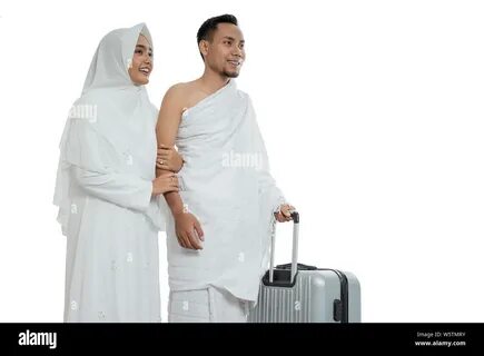 wife and husband in white traditional clothes for Ihram Stock Photo