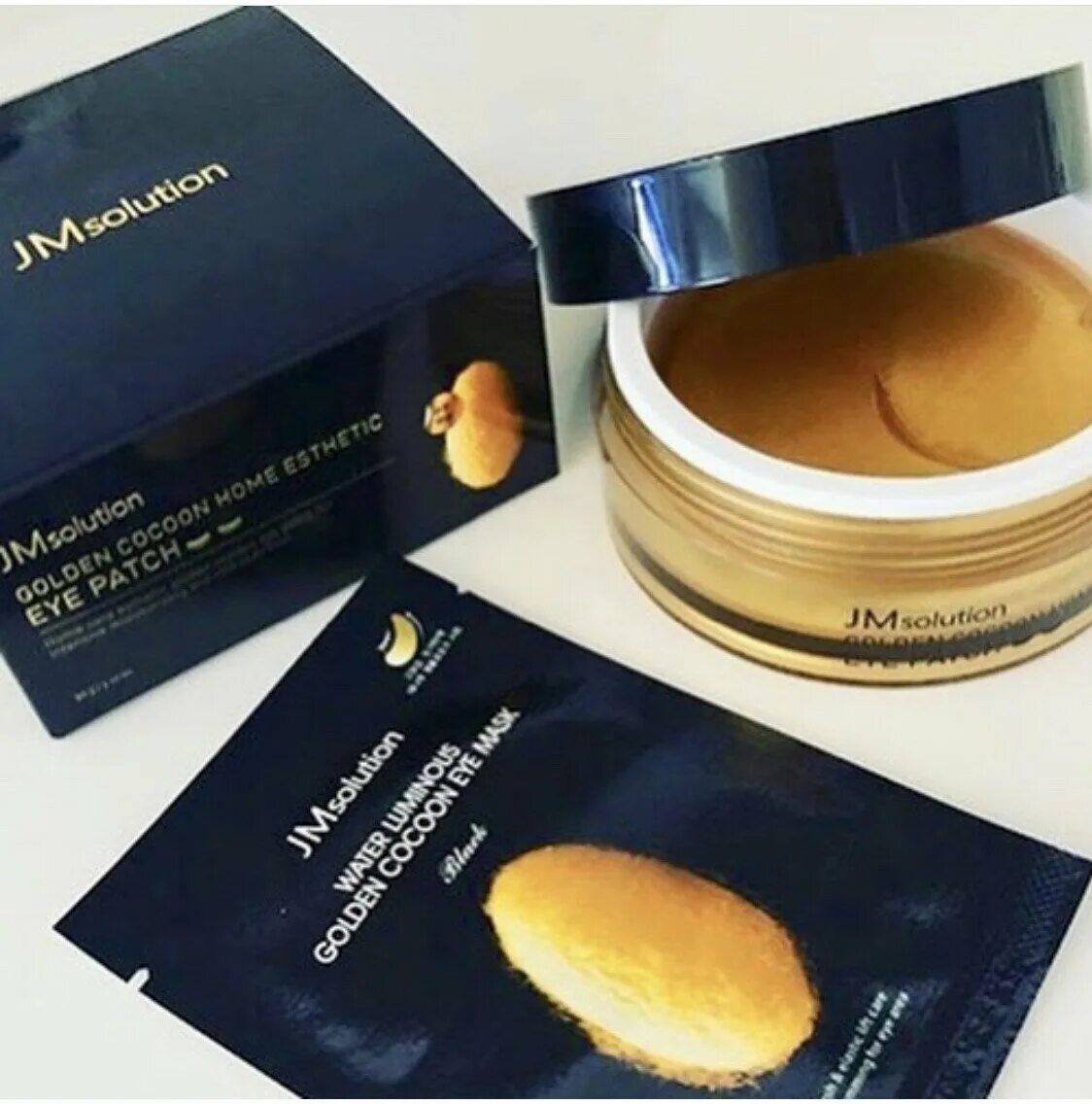 Jmsolution патчи. JMSOLUTION Silky Cocoon Home Esthetic Eye Patch. JM solution Golden Cocoon Eye Patch. JMSOLUTION патчи с золотом. JMSOLUTION патчи гидрогелевые с шёлком и золотом - Golden Cocoon Home Esthetic Eye Patch 60 шт.