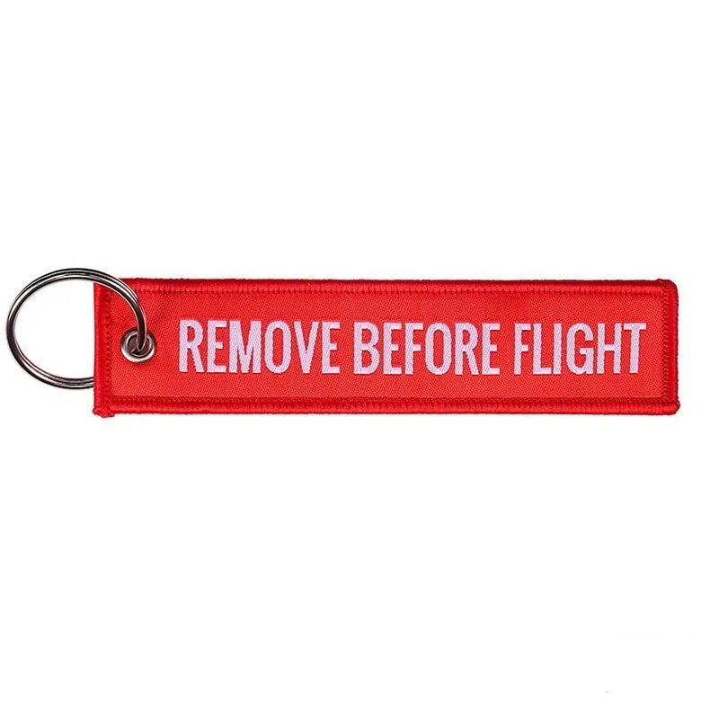 Remove before flight. Ремув бефор флайт. авиа красный брелок. красная лента remove before flight.