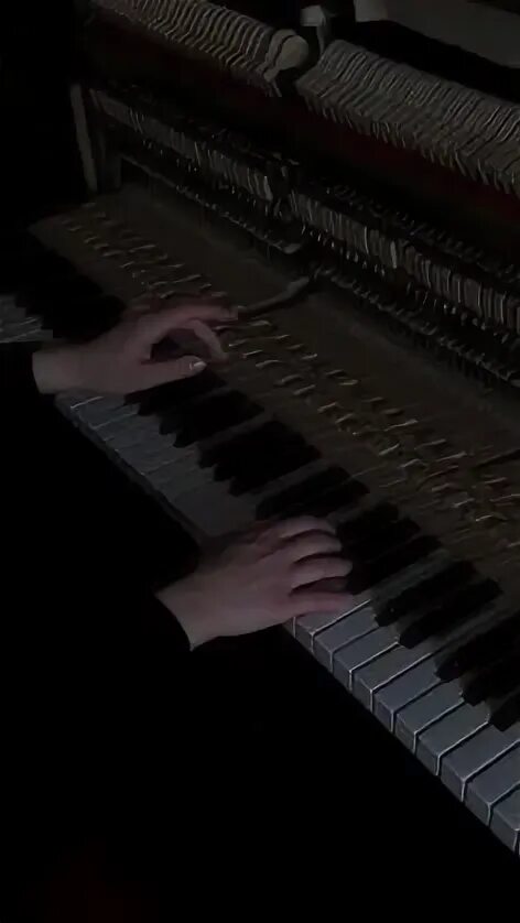 The piano is black. The piano is black