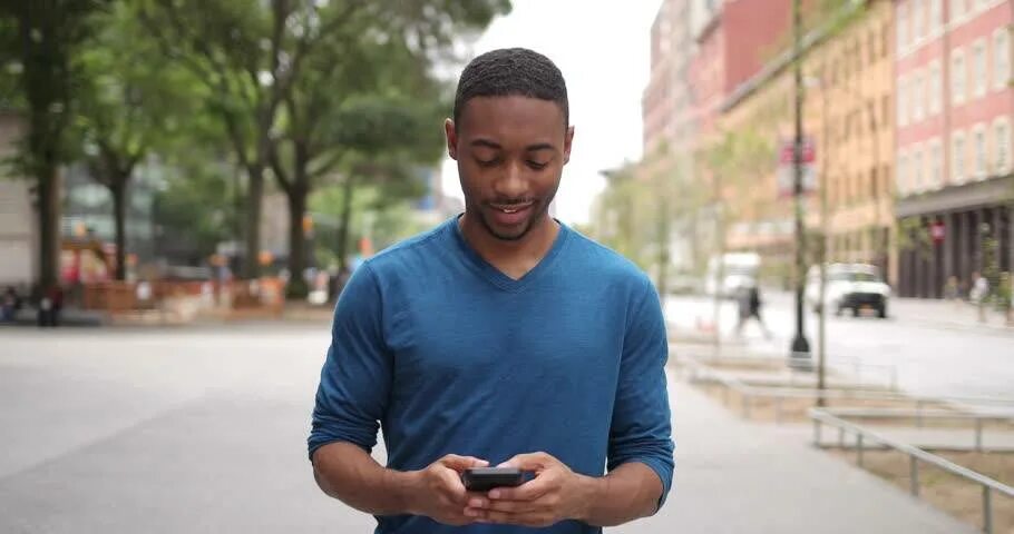 African guy with a Phone. African man. Black Street man smile. Black man portrait smiling. Ebony guy