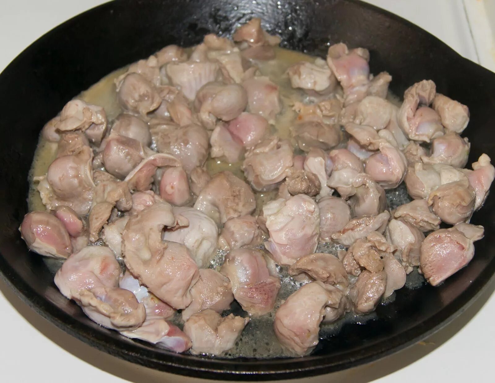 Как приготовить курин желудков. Блюда из куриных желудков. куриные желудочки приготовить. пупки куриные приготовленные.