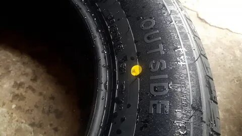Что означают желтые точки на новой резине