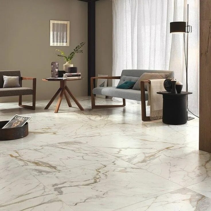 Brass threshold transition strip from white oak wood floors to chevron porcelain
