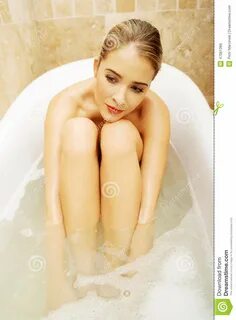 Portrait Of A Thoughtful Woman Sitting In Bath Stock Image - Image of bath,...