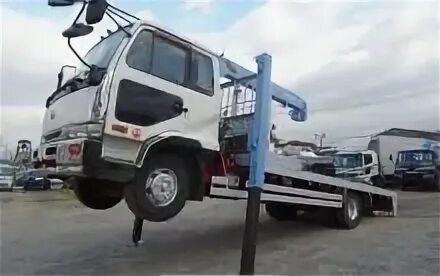 Китайские грузовые эвакуаторы. Nissan atlas 2000 эвакуатор. Японский грузовой эвакуатор. Аварийный эвакуатор. Японские эвакуаторы.