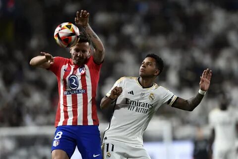 Two late goals in extra time gave Real Madrid a 5-3 win over Atletico Madri...