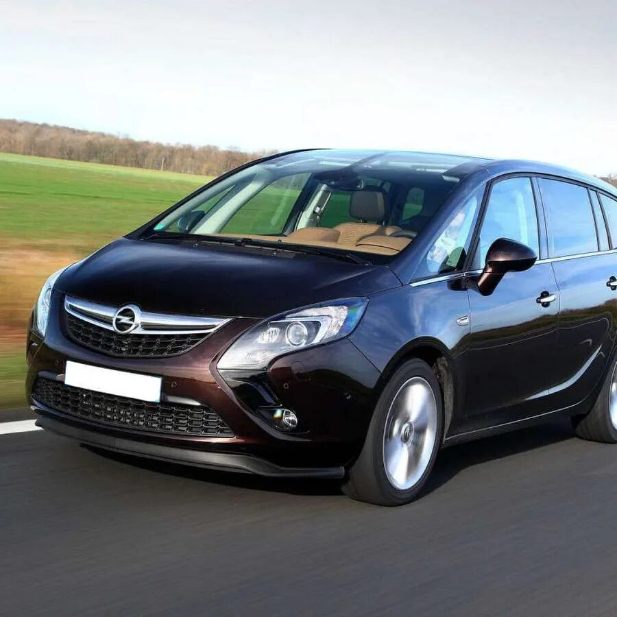 Опель зафира б годы выпуска. Opel Zafira. Zafira b OPC. Zafira Tourer. Опель Зафира Tourer.