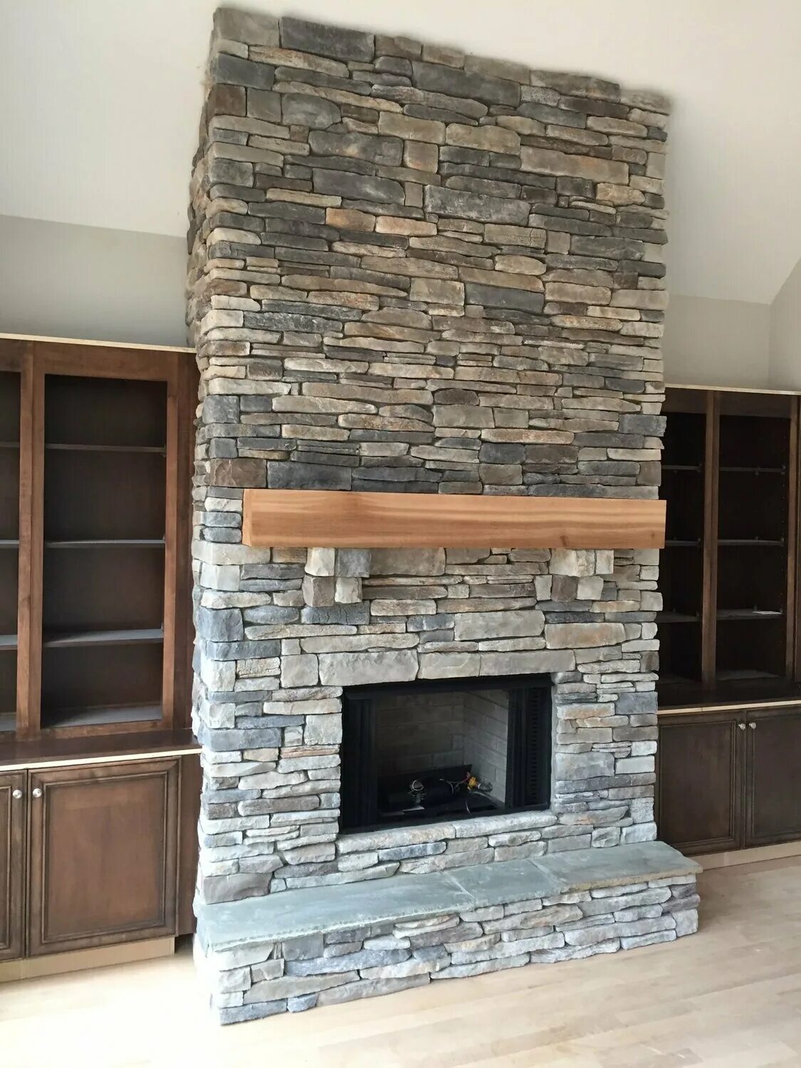 grey stone fireplace with wood mantel Purchase - 55