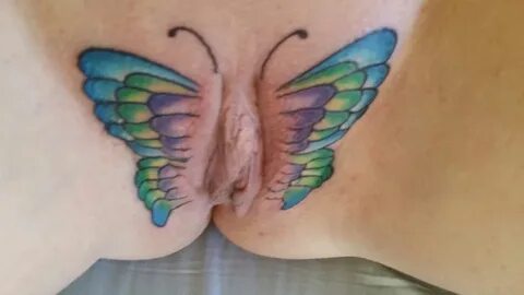 Butterfly tattoo on pussy.