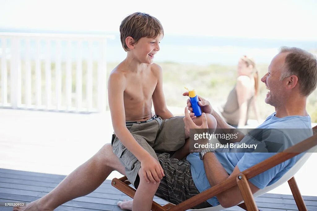Dad of a boy. Папа с сыном сидят на веранде. boy sits on his father&#039;s lap the. sitting on my son&#039;s lap. boy sits on dads lap.
