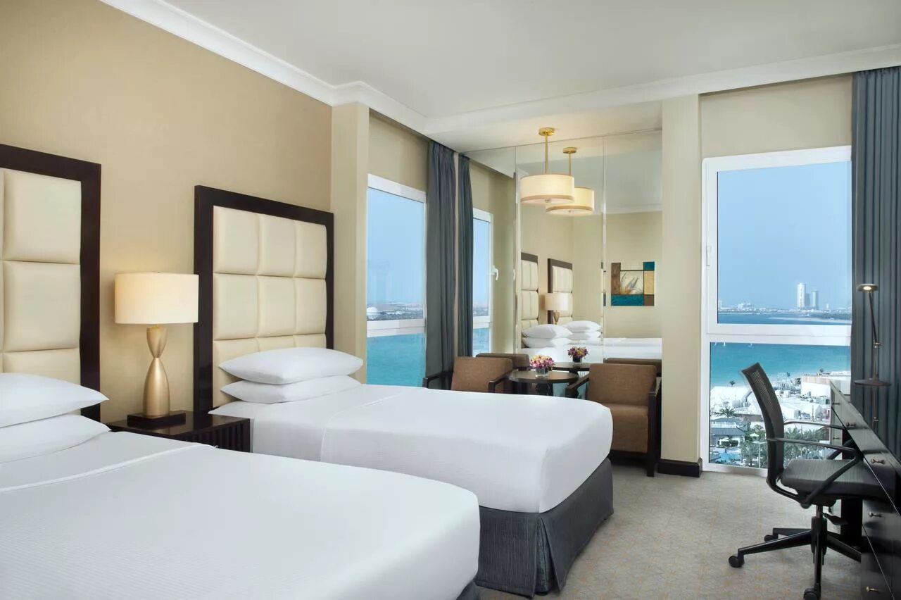 Radisson blu абу даби. Абу даби radisson corniche. рэдиссон блю отель резорт абу даби. рэдиссон абу даби корниш. radisson blu resort abu dhabi corniche 5.