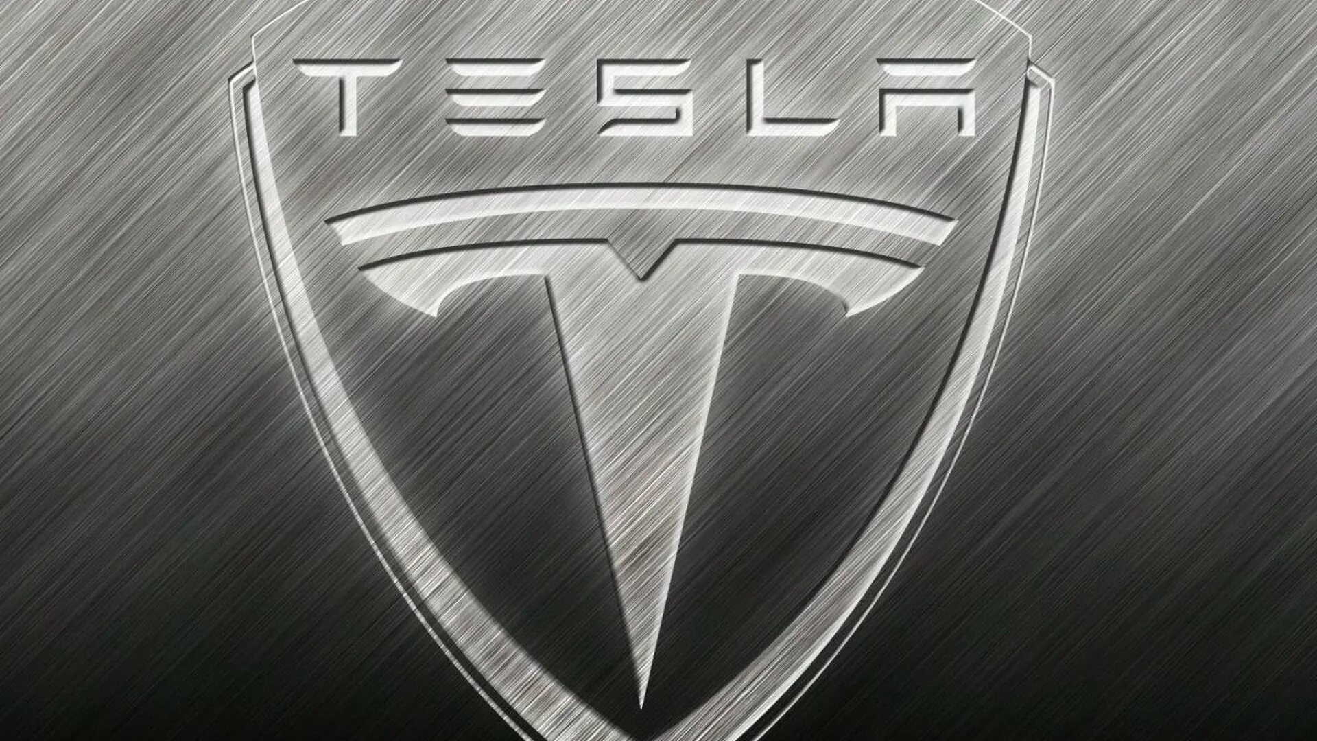 Tesla марка машины. Значки автомобилей. Значок Tesla на машине. Значок марки автомобиля Тесла.