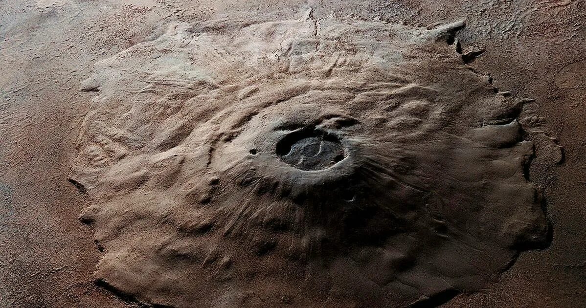 Самая высокая гора в солнечной системе находится. Марсианский потухший вулкан гора Олимп. Гора Олимп на Марсе. Olympus Mons вулкан на Марсе. Марс Планета вулкан Олимп.