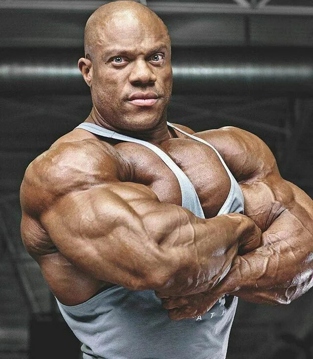 Бодибилдер фил хит. Бодибилдер фил хит. Phil heath. Филлип джеррод хит. Усатый атлет мистер олимпия.