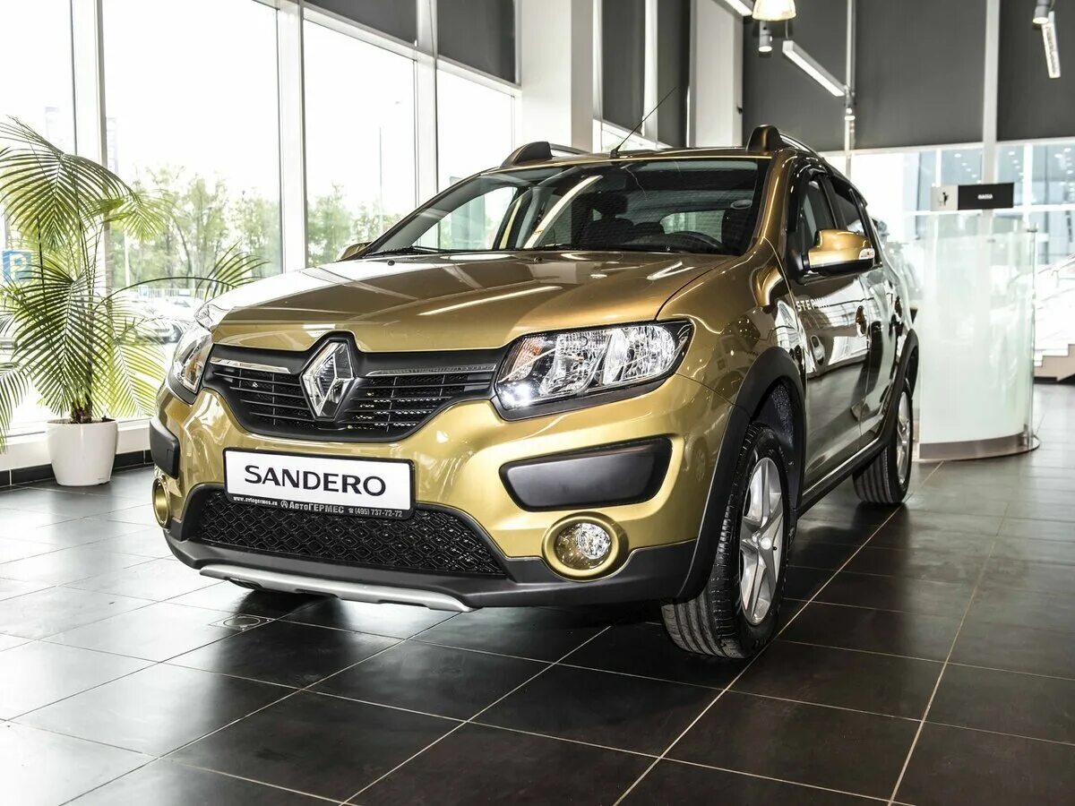 Рено Сандеро степвей. Renault Sandero Stepway автосалон. Рено Сандеро степвей золотой 2016. Новый Сандеро.