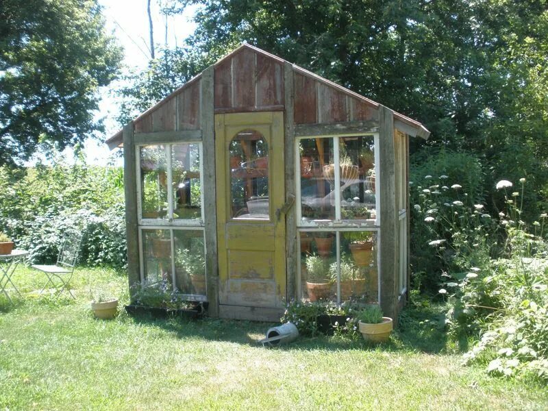 Create Your Own Green Oasis with a Sturdy Wooden Frame Greenhouse