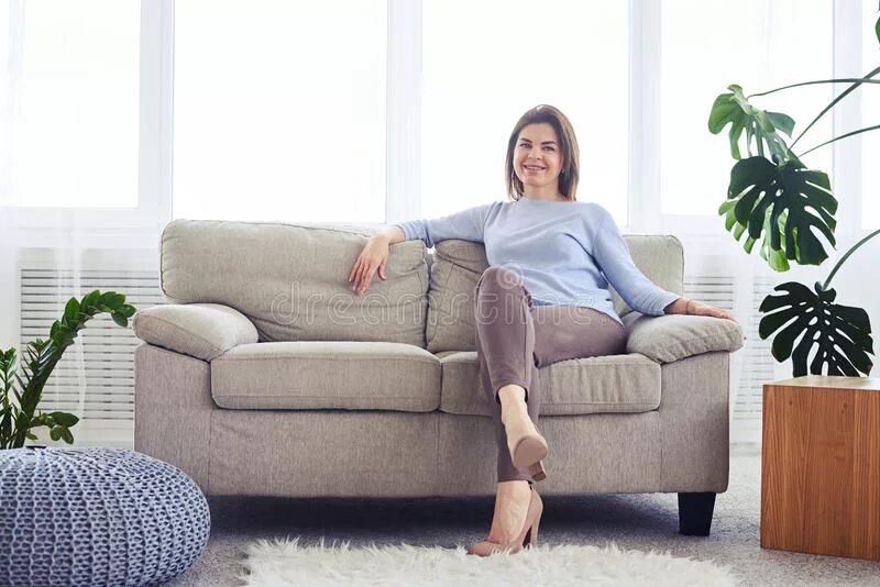 Зрелые расслабились. Он в диване дышит. Woman sit on Sofa PNG.