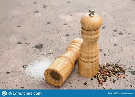 Photo about Wooden salt and pepper shaker. 