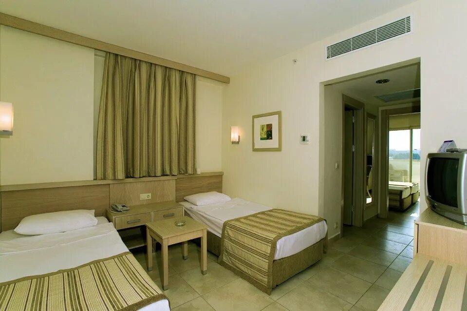 Сурал резорт 5 отель турция. Сурал Резорт отель 5. Sural Resort Hotel Сиде. Отель в Турции Sural Resort 5 Сиде. Sural Resort Hotel Family Room.