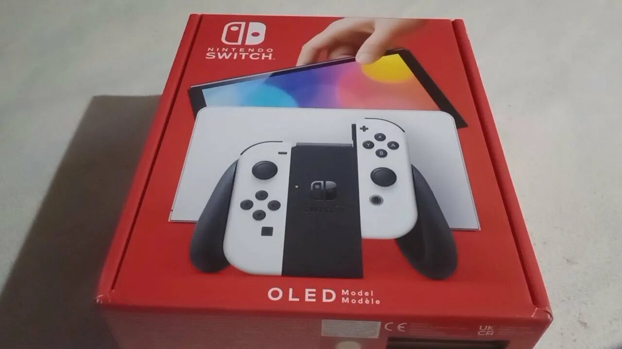 Nintendo switch oled картриджи. Нинтендо свитч олед. Нинтендо свитч новая модель. Приставка Nintendo Switch OLED model. Старая модель Nintendo Switch.