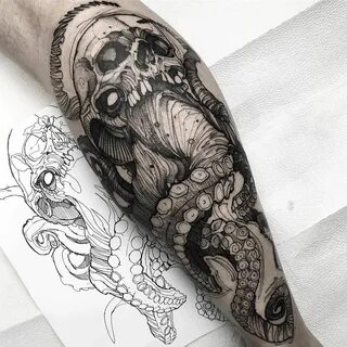 a man's arm with an octopus and skull tattoo design on the left forear...