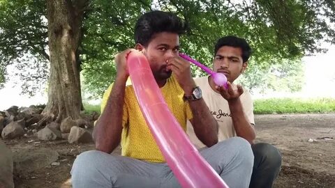 Indian man uses ears to inflate balloons in weird trick - YouTube.