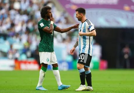 Al-Shahrani chats with Lionel Messi. 