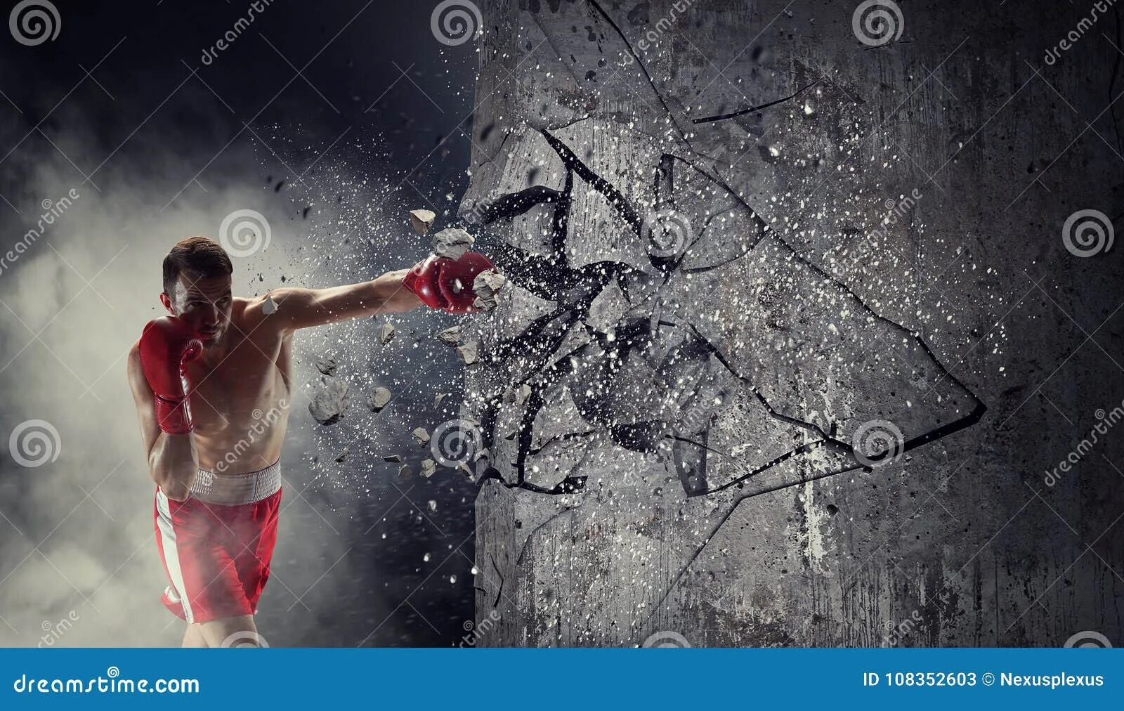 Разбивает стену спортсмен. Энергия ломает стену. Боксер разбивает стекло. Боксер разбивает стену.