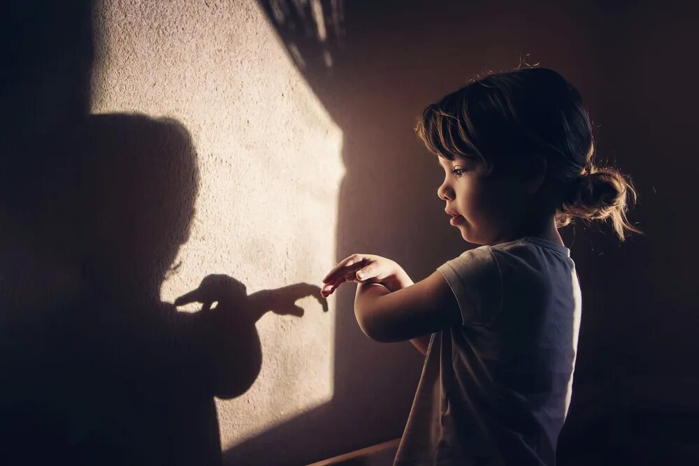 Playing shadow. Дети теней. childhood shadow. shutterstock shadow child play. making shadow.
