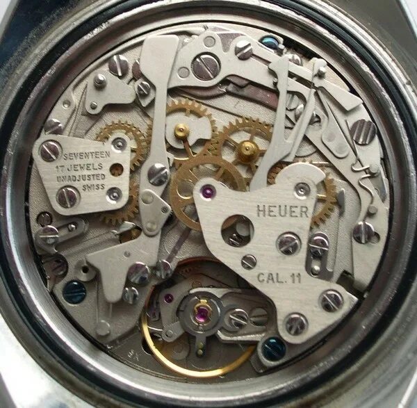 Cal 11. Heuer cal.12 movement. электронно механические часы. овальные китайские механические часы. электронно-механических.