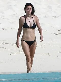 COURTNEY COX in Bikini at a Beach in Turks and Caicos.