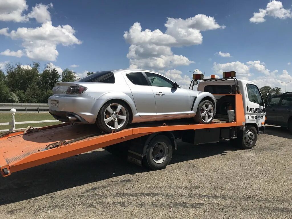 Эвакуатор краснодар 6767. Эвакуатор краснодар. Эвакуатор круглосуточно одинцово. Исузу эвакуатор со сдвижной платформой. Крытый эвакуатор краснодар.