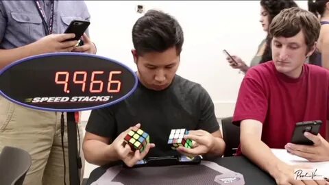 guy tries to solve 1 rubiks cube in each hand. 