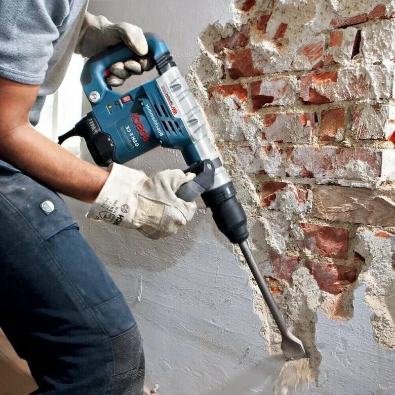 Строительные работы. Отбойный молоток bosch gsh 5 ce. Демонтаж стен. Демонтаж бетонной стены. Демонтаж картинки.