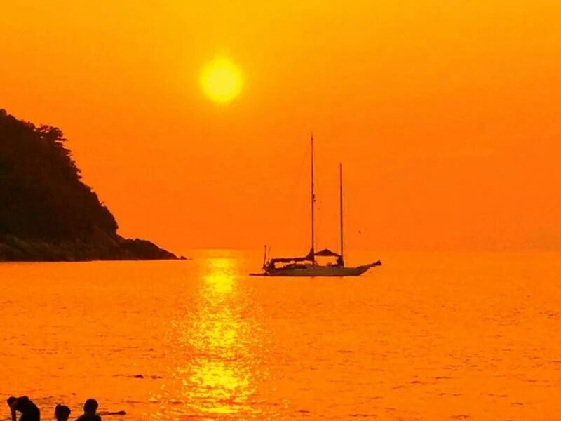 Bright orange sunset over the warm sea free image download